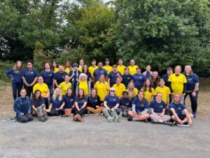 This image shows a group LOOK team photo! Consisting of all volunteers, mentors and LOOK staff, huddled together, smiling and looking at the camera. 